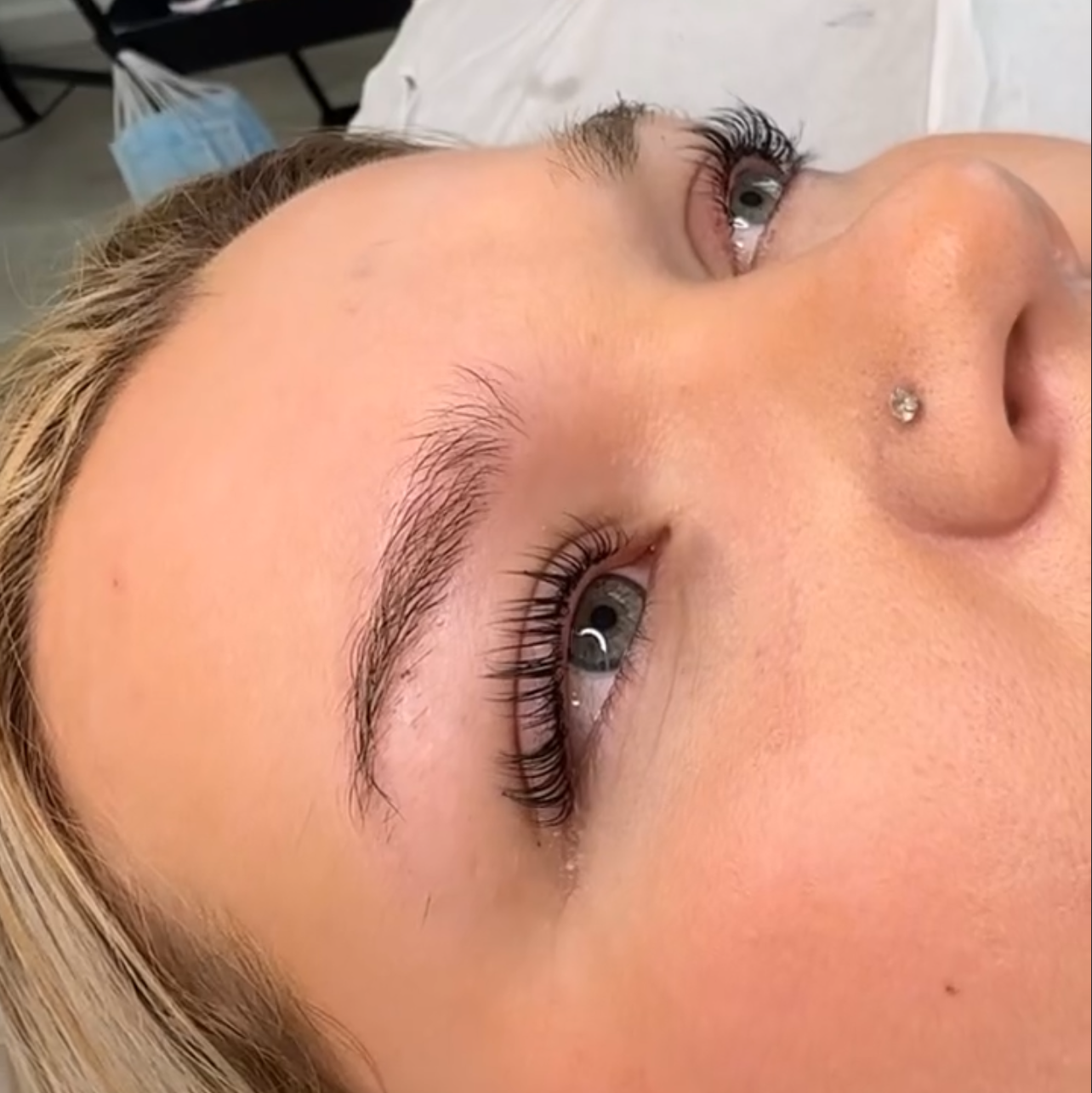 Close-up of natural lashes after professional lash lift and tint treatment