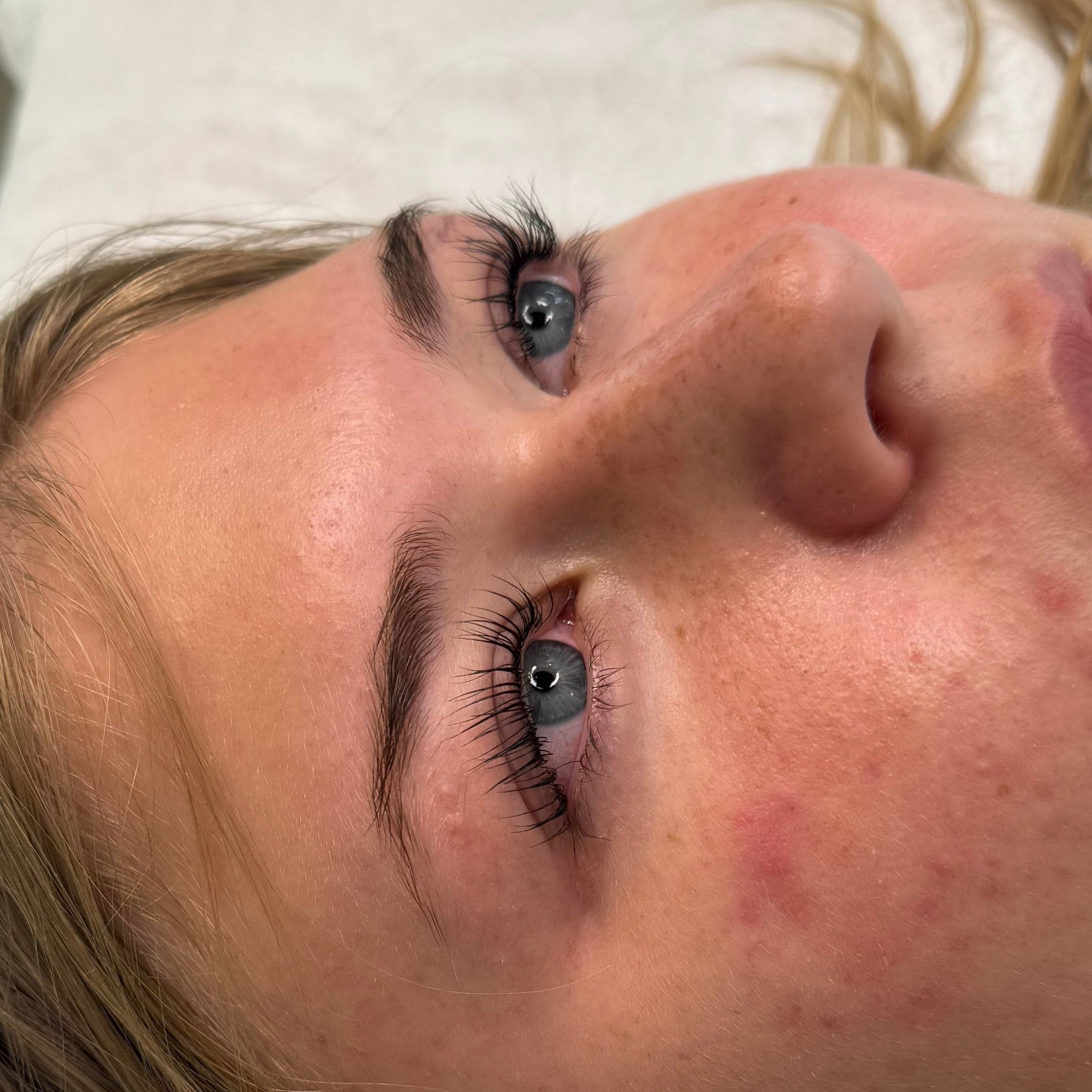 Close-up of natural lashes after professional lash lift and tint treatment